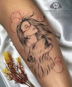 a woman's face with long hair and a dog tattoo on her leg, next to some flowers