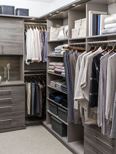 an organized closet with clothes and other items