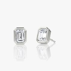 The Bezel Solitaire Studs combine vintage-inspired detail and modern appeal together for a look that’s timelessly elegant. Classic White Gold Earrings With Timeless Design, Classic White Gold Earrings, Classic Sterling Silver Earrings With Timeless Design, Classic Diamond Earrings With Polished Finish For Formal Events, Classic Diamond Earrings With Polished Finish For Formal Occasions, Classic Formal Diamond Earrings With Polished Finish, Elegant Octagon 14k Gold Earrings, Classic Emerald Cut Jewelry With Bezel Setting, Classic Jewelry With Emerald Cut Bezel Setting