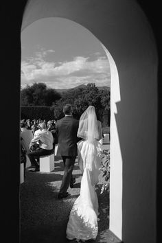 the bride and groom are walking down the aisle