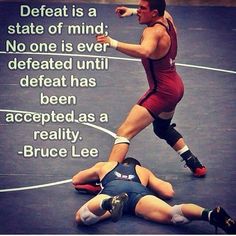 a wrestling match with a quote by bruce lee