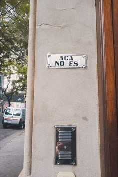 a street sign on the side of a building