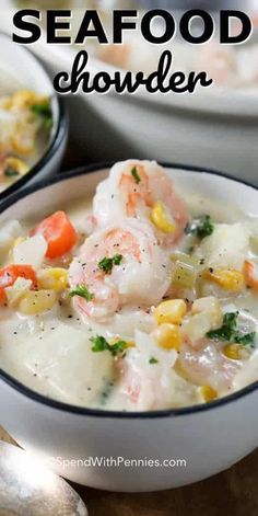 two bowls filled with seafood chowder on top of a wooden table