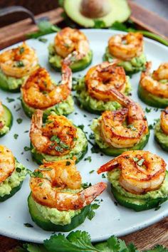 shrimp and guacamole cups with avocado garnish on a white plate