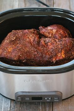 the meat is in the slow cooker ready to be cooked