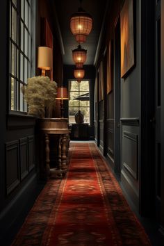 an empty hallway with red carpet and lamps