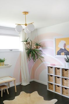 a living room filled with furniture and plants on top of it's shelves in front of a window