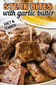 steak bites with garlic butter being drizzled over them in a white bowl