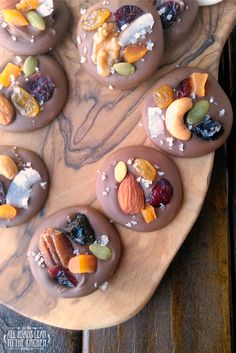 chocolate desserts with nuts and dried fruits on a wooden platter