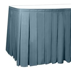 a blue table skirt with pleated edges