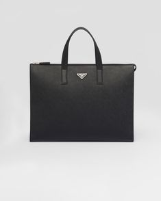 Black Saffiano Leather Tote | PRADA Classic Saffiano Leather Bag With Logo Hardware, Classic Business Bag With Logo Plaque, Modern Travel Bags With Logo Plaque, Black Business Bag With Logo Plaque, Luxury Business Bags With Logo Plaque, Designer Leather Briefcase With Zipper Closure, Luxury Formal Briefcase With Zipper Pocket, Prada Tote Bag, Prada Logo