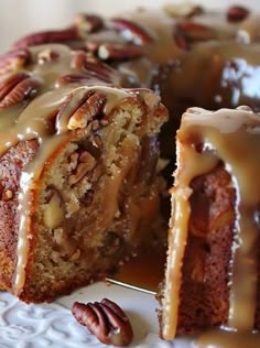 a bundt cake with pecans and icing on top