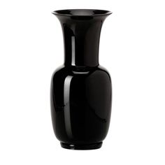 a black vase sitting on top of a white table