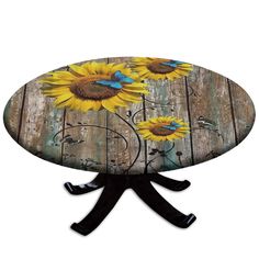 a wooden table with sunflowers painted on it