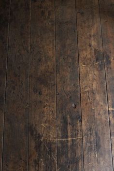 an old wooden floor has been cleaned with wood stain