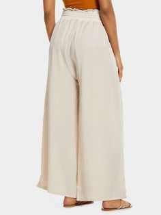 Step into comfort and fashion with our Women's High-Waisted Wide-Leg Pants. Made from high-quality polyester fabric, these loose casual trousers are designed to elevate your everyday look. Style: Wide-leg pants Fit: Loose fit Waist: High-waisted Thickness: Medium Popular Elements: High-waisted wide-leg design Color: Off-White Sizes Available: S, M, L These pants are not only stylish but also versatile, perfect for a day out with friends or a casual work setting. The high-waisted design flatters High Waist Relaxed Fit Solid Color Harem Pants, Relaxed Fit Solid Color Wide-leg Harem Pants, High-waisted Beige Solid Color Pants, White Wide-leg Harem Pants With Elastic Waistband, High-waisted Beige Pants, White Wide Leg Harem Pants For Loungewear, White Plain Bottoms For Summer, White Non-stretch Pants, Baggy Beige Pants With Solid Color