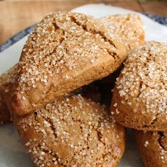 several cookies are stacked on top of each other in a plate with some sprinkles