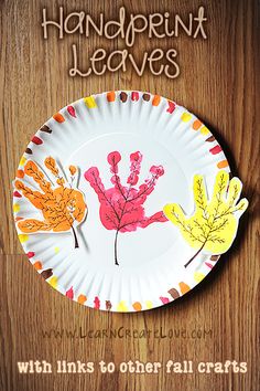 a paper plate with handprint leaves on it