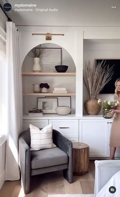 a living room filled with furniture and shelves