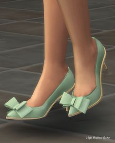 a woman's feet wearing green shoes with bows