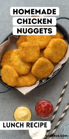 homemade chicken nuggets in a basket with ketchup and mustard