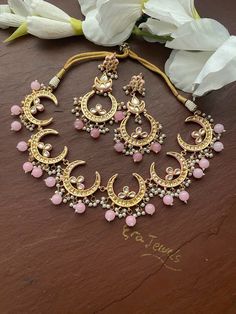 Elegant and delicate  Indian Necklace With  Gold Plating. Indian Bridal Kundan set One Gram Jewelry Choker Set. Very Gorgeous and pretty, fine Kundan choker necklace with matching earrings  Adjustable length with help of dori (cord) Ready to ship from  NJ, United States  Gorgeous 24 K gold plated. Pink Necklace For Ceremonial Occasions And Diwali, Pink Ceremonial Necklace For Diwali, Traditional Round Choker For Festivals, Bollywood Style Jewelry With Motifs For Wedding, Kundan Sets For Eid Gift, Bollywood Style Wedding Jewelry With Motifs, Ceremonial Kundan Chandbali Necklace With Motifs, Chandbali Hand Set Choker For Festivals, Ceremonial Pink Kundan Jewelry