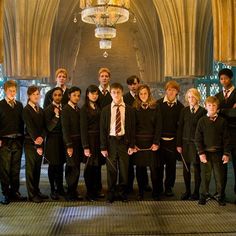 the harry potters are posing for a group photo in front of hogwart's castle