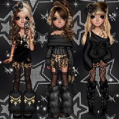 three dolls are dressed up in black and gold outfits, one is holding a cell phone