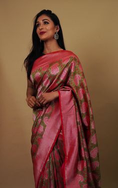 This pink and green combination saree is a work of Kadua craft that is carefully woven on a Katan Silk fabric. Its a rare handloom saree for wedding and the big pink borders gives the saree its subtle appearance. It takes 30-45 days to complete this beautiful art.  Sari Length 5.5Meters, Blouse - 1Meter (attached). Note - The blouse shown is for styling purposes only. Pink Handloom Pre-draped Saree In Tissue Silk, Designer Handloom Pre-draped Green Saree, Pink Tissue Silk Handloom Pre-draped Saree, Pink Tissue Silk Pre-draped Saree Handloom, Pink Handloom Raw Silk Pre-draped Saree, Pink Handloom Tissue Silk Saree, Pink Tissue Silk Handloom Saree, Green Katan Silk Saree With Weaving Work, Green Raw Silk Pre-draped Saree With Zari Weaving