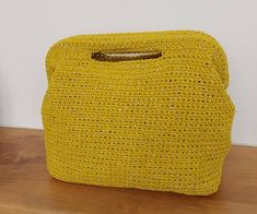 Beautiful and capacious handbag, crocheted with cotton, viscosa and metallic yarn coupled. The lining is in pure cotton  The handbag is versatile and can be used both for an elegant evening and during the day for a unique outfit. The handbag measures: width 27 cm, height 20 cm, depth 13 cm. Suitable to embellish even the simplest dress. Great gift for the people you love orfor themselves Customs: Customs and import taxes are at your expense Feel free to contact me for any other questions Crochet Clutch Bags, Unique Outfit, Crochet Clutch, Metallic Yarn, Ceremony Wedding, Handmade Bag, Bag Handmade, Handmade Bags, Simple Dresses