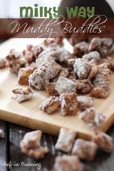 a wooden cutting board topped with muddy buddies