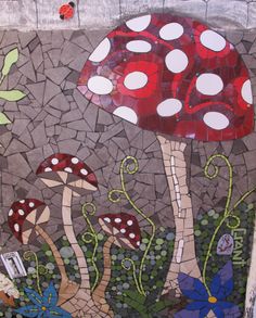 a mosaic art work with mushrooms and flowers