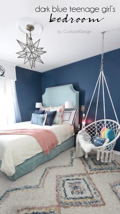 a bed room with a neatly made bed and a hanging chair