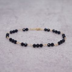 Elegant Black Bracelets With Faceted Beads, Black Bracelets With Tiny Beads For Party, Elegant Black Crystal Bracelet With Faceted Beads, Elegant Onyx Bracelets With Faceted Beads, Elegant Onyx Bracelet With Faceted Beads, Dainty Black Beaded Bracelets With Tiny Beads, Faceted Black Crystal Bracelet Gift, Elegant Black Faceted Bracelet, Black Spinel Jewelry