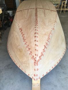 a wooden boat being built in a shop