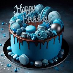 a birthday cake with blue frosting and decorations