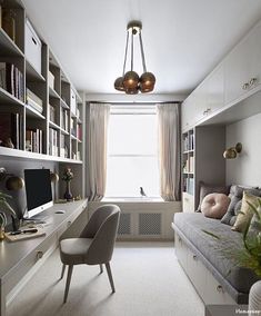 a living room filled with lots of furniture and bookshelves next to a window