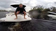 a man is sitting on the back of a boat