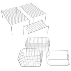 four wire baskets sitting next to each other on top of a white surface with lines drawn across them