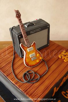 a cake with a guitar and amp on it