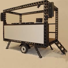 a small black and white cart with wheels