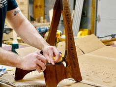 a man working on a piece of wood