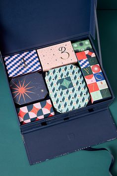 an open blue box filled with different types of ties