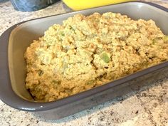 a casserole dish filled with food on top of a counter