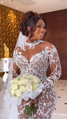 a woman in a wedding dress holding a bouquet