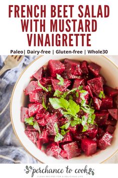 a white bowl filled with beet salad and topped with parsley