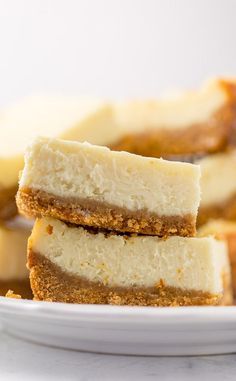 several pieces of cheesecake on a white plate