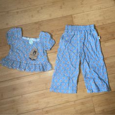 Nwt Girls Size 2t Blue Print Outfit - Ruffle Top & Pants Spring Matching Set Cotton Pants, Spring Cotton Pants Matching Set, Playful Blue Ruffled Bottoms, Playful Cotton Bottoms In Matching Set, Spring Cotton Matching Set Bottoms, Casual Playwear Sets With Ruffles, Cute Spring Sets With Elastic Waistband, Cute Light Blue Sets For Playwear, Cute Light Blue Cotton Bottoms