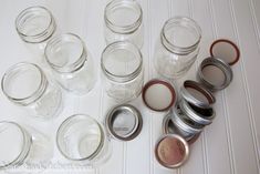 there are many jars with lids on the table