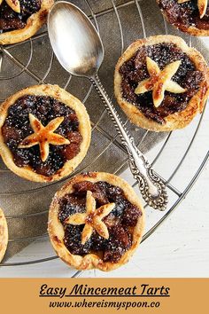 mini mincemeat tarts on a wire rack with spoons